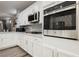Modern kitchen features stainless steel appliances, sleek countertops, and ample cabinet space at 2306 Valley Cottage Ave, Henderson, NV 89052