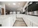 Large kitchen with an island, stainless steel appliances, and seamless open flow to the dining and living areas at 2306 Valley Cottage Ave, Henderson, NV 89052