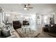Open-concept living room with wood-look flooring, bright light, and comfortable seating at 2306 Valley Cottage Ave, Henderson, NV 89052