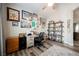This well-lit office features hardwood floors, a ceiling fan, and workspace; perfect for working at home at 2306 Valley Cottage Ave, Henderson, NV 89052