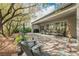 Covered patio with brick pavers, lounge furniture, ceiling fan, and outdoor kitchen create a relaxing and inviting outdoor space at 2306 Valley Cottage Ave, Henderson, NV 89052