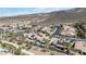 A high angle shot of a community with several homes that have a private backyard oasis, which includes a pool and landscaping at 2665 Chateau Clermont St, Henderson, NV 89044
