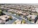 An overhead shot of a planned residential neighborhood, showcasing similar homes and landscaping at 2665 Chateau Clermont St, Henderson, NV 89044