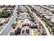 The aerial view captures houses, a community walking path, and the surrounding neighborhood's layout and streetscape at 2665 Chateau Clermont St, Henderson, NV 89044