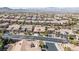 A bird's eye view showing the house nestled in a community with mountain views on the horizon at 2665 Chateau Clermont St, Henderson, NV 89044