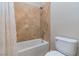 Bathroom showcasing a tiled shower, white toilet, and white shower curtain at 2665 Chateau Clermont St, Henderson, NV 89044