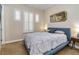 Comfortable bedroom with plush carpeting, a sleek blue bed frame, and white shuttered windows at 2665 Chateau Clermont St, Henderson, NV 89044