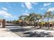 Gated entry to the Viderias neighborhood with mature trees and landscaping at 2665 Chateau Clermont St, Henderson, NV 89044