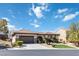 Well-maintained single-story home with tile roof, two-car garage, and manicured desert landscaping at 2665 Chateau Clermont St, Henderson, NV 89044