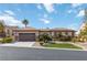 Charming single-story home with a tile roof, arched entryway, and desert-friendly landscaping at 2665 Chateau Clermont St, Henderson, NV 89044