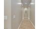 Neutral hallway featuring tile flooring and smooth plastered walls at 2665 Chateau Clermont St, Henderson, NV 89044