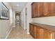 Hallway features beautiful built-in cabinets, tile flooring, recessed lighting, and natural light from the window at 2665 Chateau Clermont St, Henderson, NV 89044