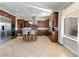 Gourmet kitchen features stainless steel appliances, island with seating, and extensive cabinets at 2665 Chateau Clermont St, Henderson, NV 89044