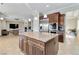 Open concept with gourmet kitchen overlooking large living area with bar stool seating at 2665 Chateau Clermont St, Henderson, NV 89044