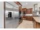 Gourmet kitchen featuring stainless steel appliances, and rich wood cabinetry at 2665 Chateau Clermont St, Henderson, NV 89044
