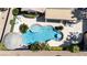 An aerial view of a private outdoor pool and landscaped patio with dining and lounging areas at 2665 Chateau Clermont St, Henderson, NV 89044