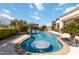 Backyard pool with a swim-up bar, tiki hut, and lush landscaping at 2665 Chateau Clermont St, Henderson, NV 89044