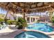 Backyard oasis featuring a swimming pool, in-ground jacuzzi, and covered patio at 2665 Chateau Clermont St, Henderson, NV 89044
