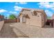 Home exterior with rock landscaping, windows, and satellite dish at 2709 Rue Montpellier Ave, Henderson, NV 89044