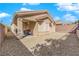 Open backyard with rock ground cover and covered patio at 2709 Rue Montpellier Ave, Henderson, NV 89044