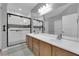 Spacious bathroom with double sinks and a large glass enclosed shower with tile surround at 2709 Rue Montpellier Ave, Henderson, NV 89044