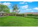 Well-maintained common area with green grass, trees, and covered seating at 2709 Rue Montpellier Ave, Henderson, NV 89044