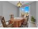 Cozy dining area with a charming light fixture and window with natural light at 2709 Rue Montpellier Ave, Henderson, NV 89044