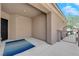 Covered patio featuring a decorative iron gate and a striking entry door at 2709 Rue Montpellier Ave, Henderson, NV 89044