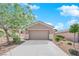 Single-story home with desert landscaping, well-maintained lawn, and two-car garage at 2709 Rue Montpellier Ave, Henderson, NV 89044