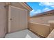 Covered patio area with screen door to interior at 2709 Rue Montpellier Ave, Henderson, NV 89044