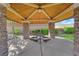 Community pavilion has stone pillars and picnic table for outdoor gathering at 2709 Rue Montpellier Ave, Henderson, NV 89044