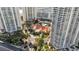 Aerial view of luxurious estate with large building, pool, and high-rise at 2777 Paradise Rd # 301, Las Vegas, NV 89109