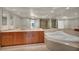 Modern bathroom featuring double sinks, a soaking tub, travertine countertops and a separate shower at 2777 Paradise Rd # 301, Las Vegas, NV 89109