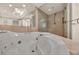 Bright bathroom featuring a white spa tub and glass enclosed shower at 2777 Paradise Rd # 301, Las Vegas, NV 89109