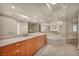 Bright bathroom featuring double sinks, wood cabinets, and a luxurious spa tub at 2777 Paradise Rd # 301, Las Vegas, NV 89109