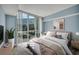Cozy bedroom with ample natural light from large windows and a comfortable king size bed at 2777 Paradise Rd # 301, Las Vegas, NV 89109