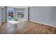Bright bedroom with wood flooring and sliding glass doors to a pool-view balcony at 2777 Paradise Rd # 301, Las Vegas, NV 89109
