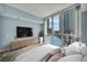 Comfortable bedroom with a view of the Las Vegas Strip through large windows at 2777 Paradise Rd # 301, Las Vegas, NV 89109