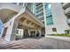 Covered entryway of a luxury building with modern architecture and valet service, offering convenience and style at 2777 Paradise Rd # 301, Las Vegas, NV 89109