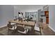 Dining room with wood table and seating for six overlooking living room and outdoor views at 2777 Paradise Rd # 301, Las Vegas, NV 89109