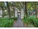Pathway through lush greenery leads to an elegant gated entrance, creating a sense of privacy and tranquility at 2777 Paradise Rd # 301, Las Vegas, NV 89109