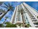 Elegant high-rise building with balconies, palm trees, and modern architecture at 2777 Paradise Rd # 301, Las Vegas, NV 89109