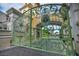 Ornate green gates leading to a grand courtyard, enhancing the property's curb appeal and exclusivity at 2777 Paradise Rd # 301, Las Vegas, NV 89109