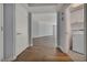 Hallway featuring hardwood floors, with an archway leading to the living area and laundry room at 2777 Paradise Rd # 301, Las Vegas, NV 89109