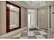 Hallway featuring large mirror, checkered floors, and views into other rooms inside apartment 304 at 2777 Paradise Rd # 301, Las Vegas, NV 89109