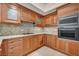 Modern kitchen featuring wood cabinets and stainless steel appliances at 2777 Paradise Rd # 301, Las Vegas, NV 89109