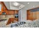 Kitchen with granite countertops, wood cabinets, and stainless steel appliances at 2777 Paradise Rd # 301, Las Vegas, NV 89109