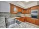 Kitchen with stainless steel sink, granite countertops and backsplash, and light wood cabinetry at 2777 Paradise Rd # 301, Las Vegas, NV 89109