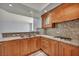 Kitchen with granite countertops, stainless steel range and wood cabinetry at 2777 Paradise Rd # 301, Las Vegas, NV 89109