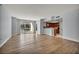 Spacious living room with light wood floors, balcony with a view, and open access to the kitchen at 2777 Paradise Rd # 301, Las Vegas, NV 89109